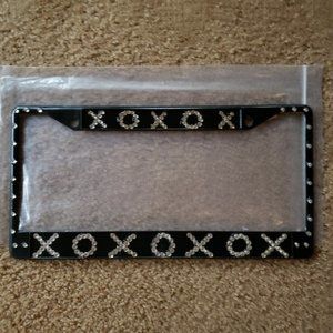 Metal license plate holder with crystals